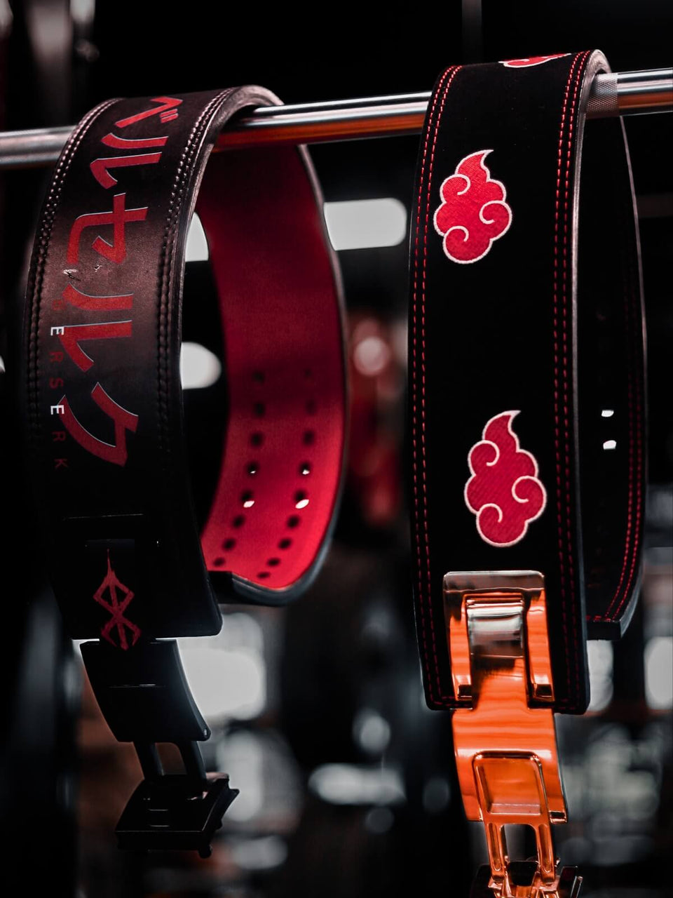 Mobile view for anime weightlifting belt collection | Akatsuki lifting belt and Berserk lifting belt hanging together