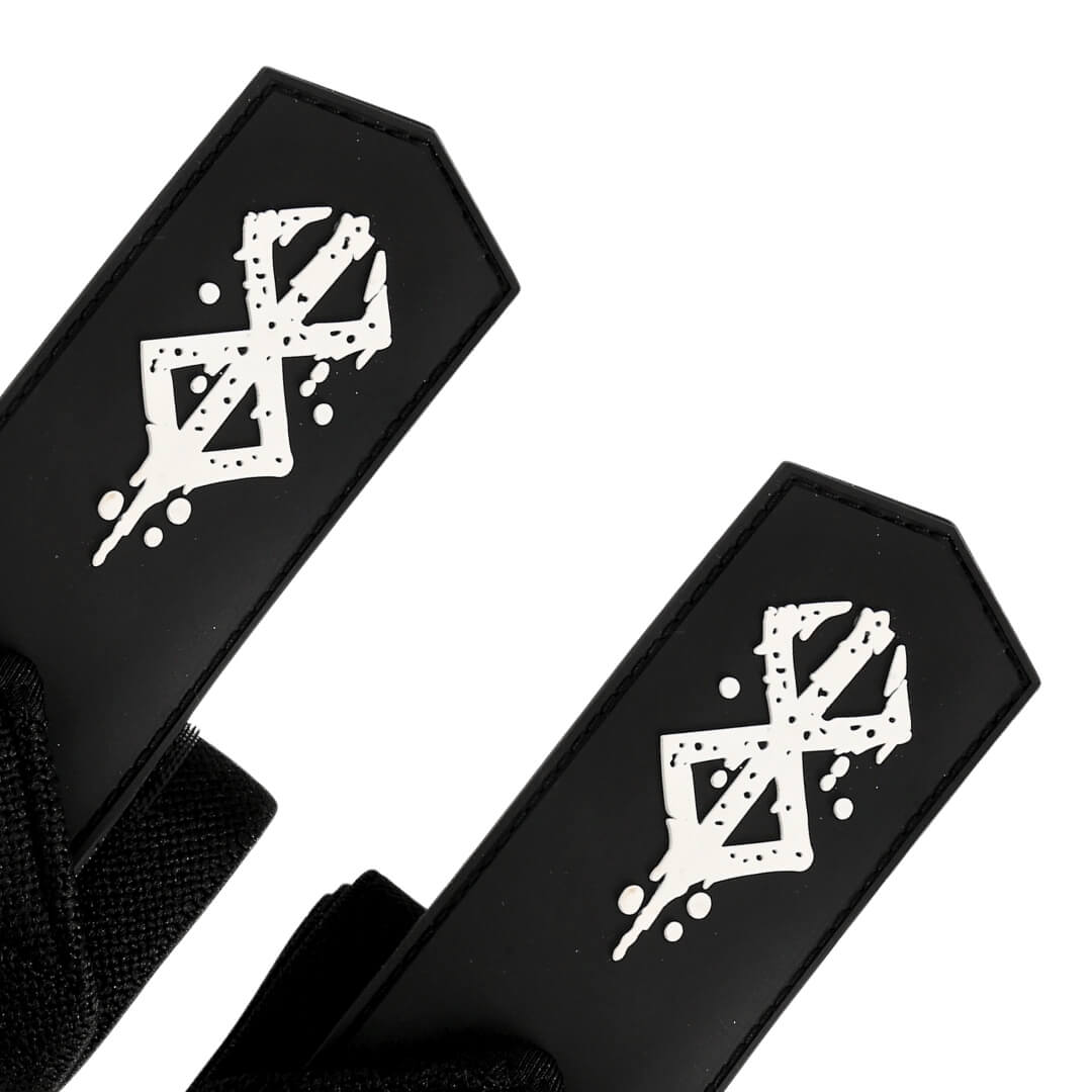 Close up of Berserk pattern from Berserk "Warrior" Wrist Wraps On Display. Perfect for weightlifting,and strength training. A unique anime gym gear gift for fitness lovers.