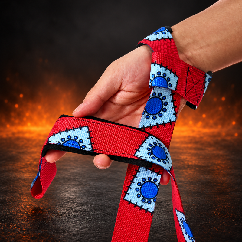 Wrist view of the Boro lifting straps looped over the hand, red webbing with pale blue stitched patches