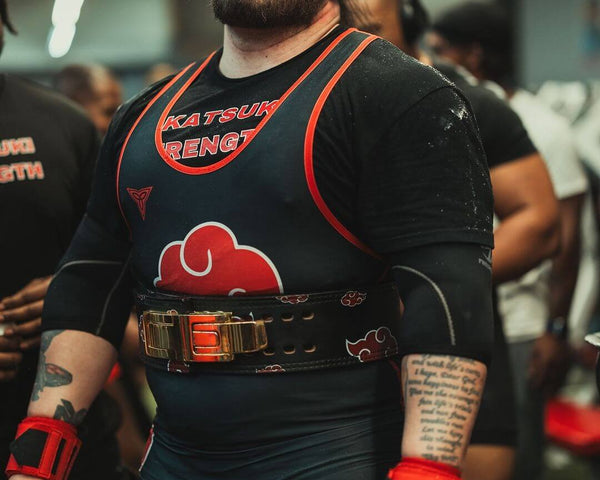Storm in his competition singlet and lever belt, standing ready between attempts at the Iron Built Games 2024.