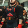 Storm in his competition singlet and lever belt, standing ready between attempts at the Iron Built Games 2024.