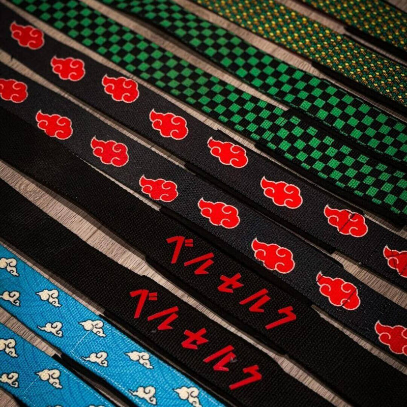 Patterned lifting straps arranged diagonally on a wooden surface.