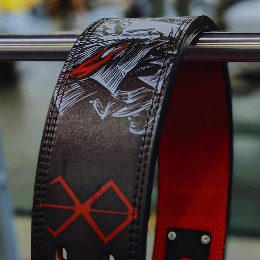 Close-up of a black and red Berserk-inspired weightlifting belt featuring a fierce anime character’s face, highlighting bold style and strong support for serious lifters.