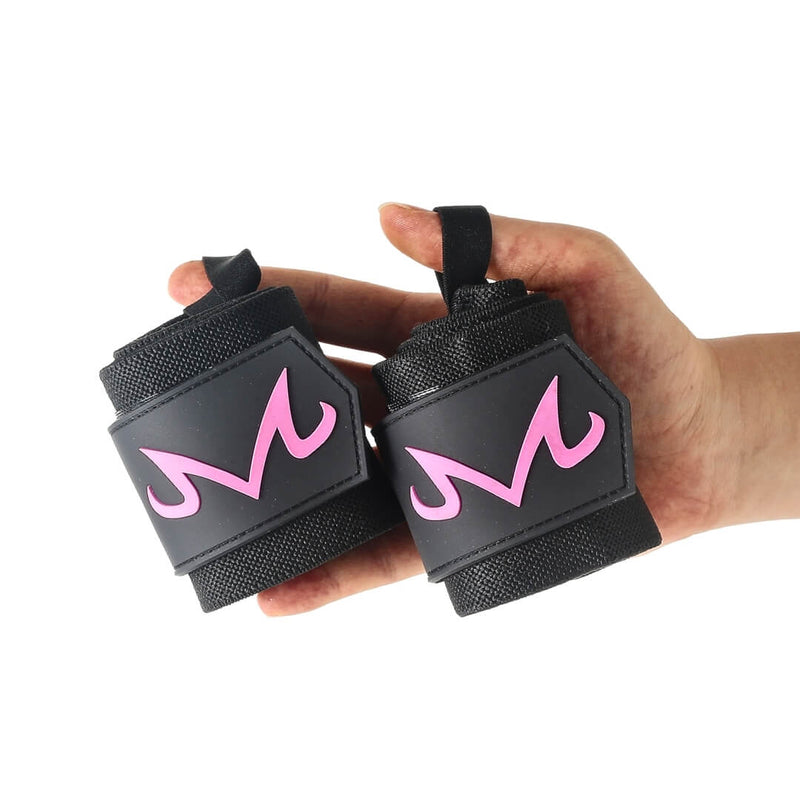 Rolled pair of M Pink wrist wraps held in one hand, black wraps with a curled hot pink M on each end tab