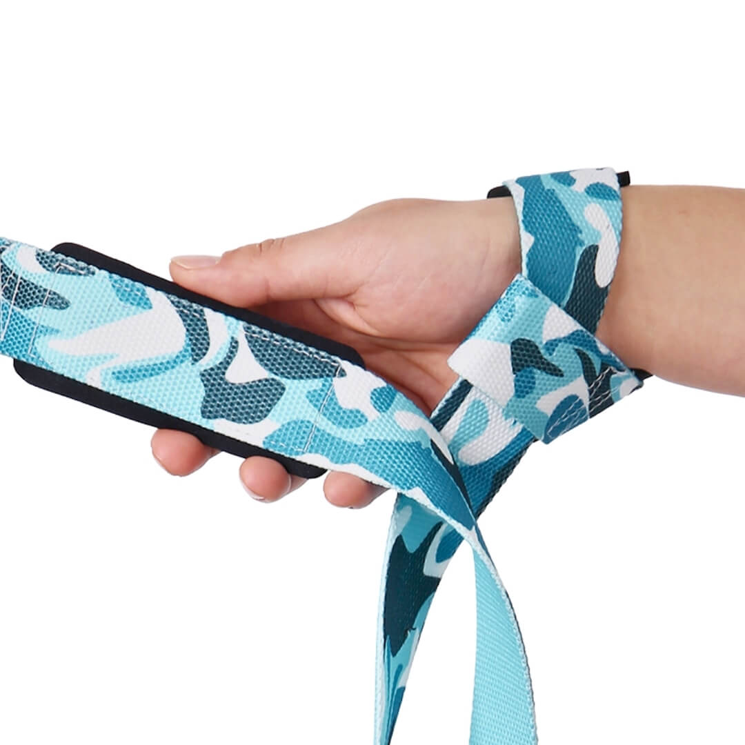 Wrist view of the Deep Blue lifting straps, turquoise, deep teal and white camo with black padding under the palm