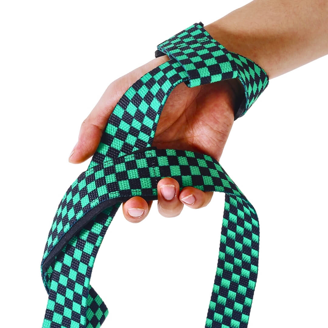 Edo deadlift straps in the green Ichimatsu style, a green and black checkerboard strap looped around the wrist and palm