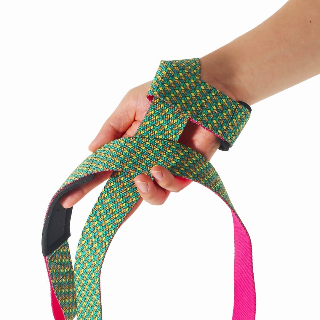 Edo lifting straps in the Bishamon style, green and gold tortoiseshell hexagons with a pink underside, looped around the hand