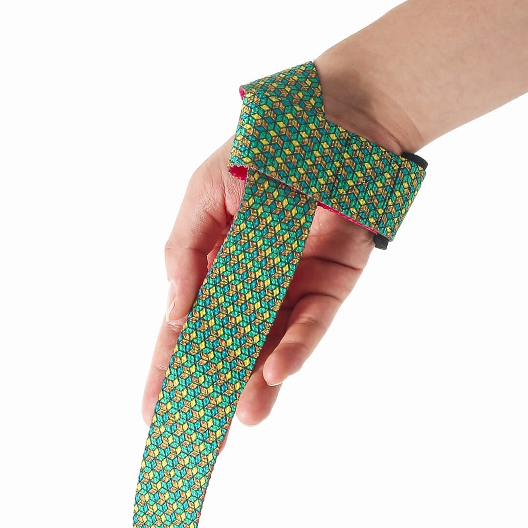 Bishamon Edo lifting straps for deadlifts on the wrist, a green tortoiseshell pattern strap with a pink edge