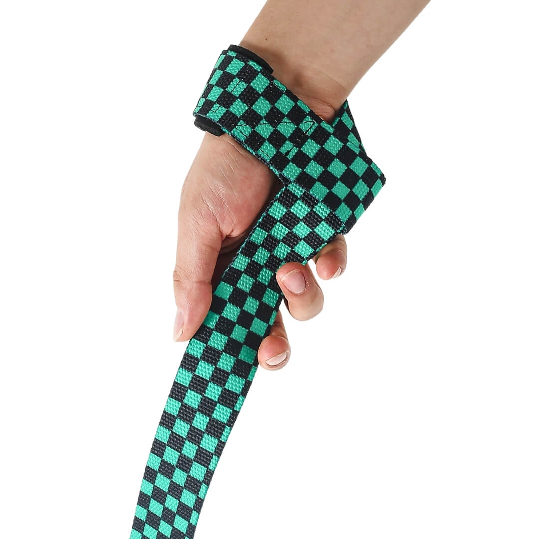 Side view of the Ichimatsu Edo weightlifting straps, a black and green checkerboard strap hanging from the wrist