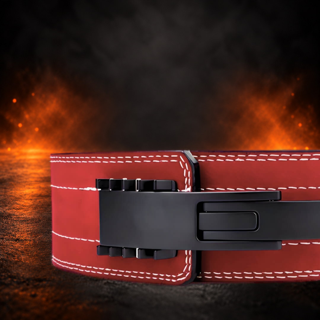10mm lever belt in red suede, close-up of the closed matte black lever and white stitching.