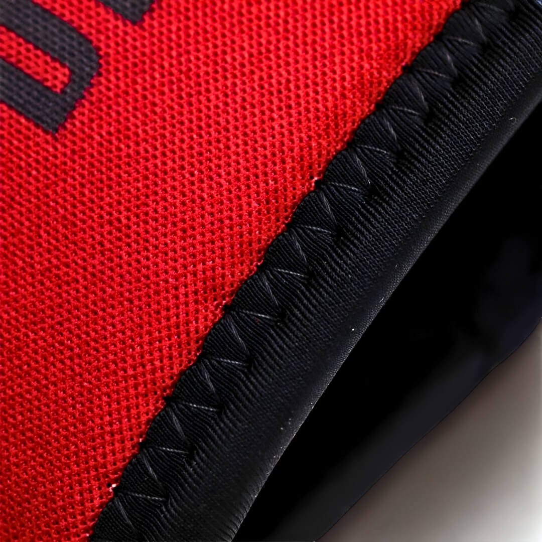 7mm knee sleeves in red, close-up of the zigzag-stitched black binding along the opening.