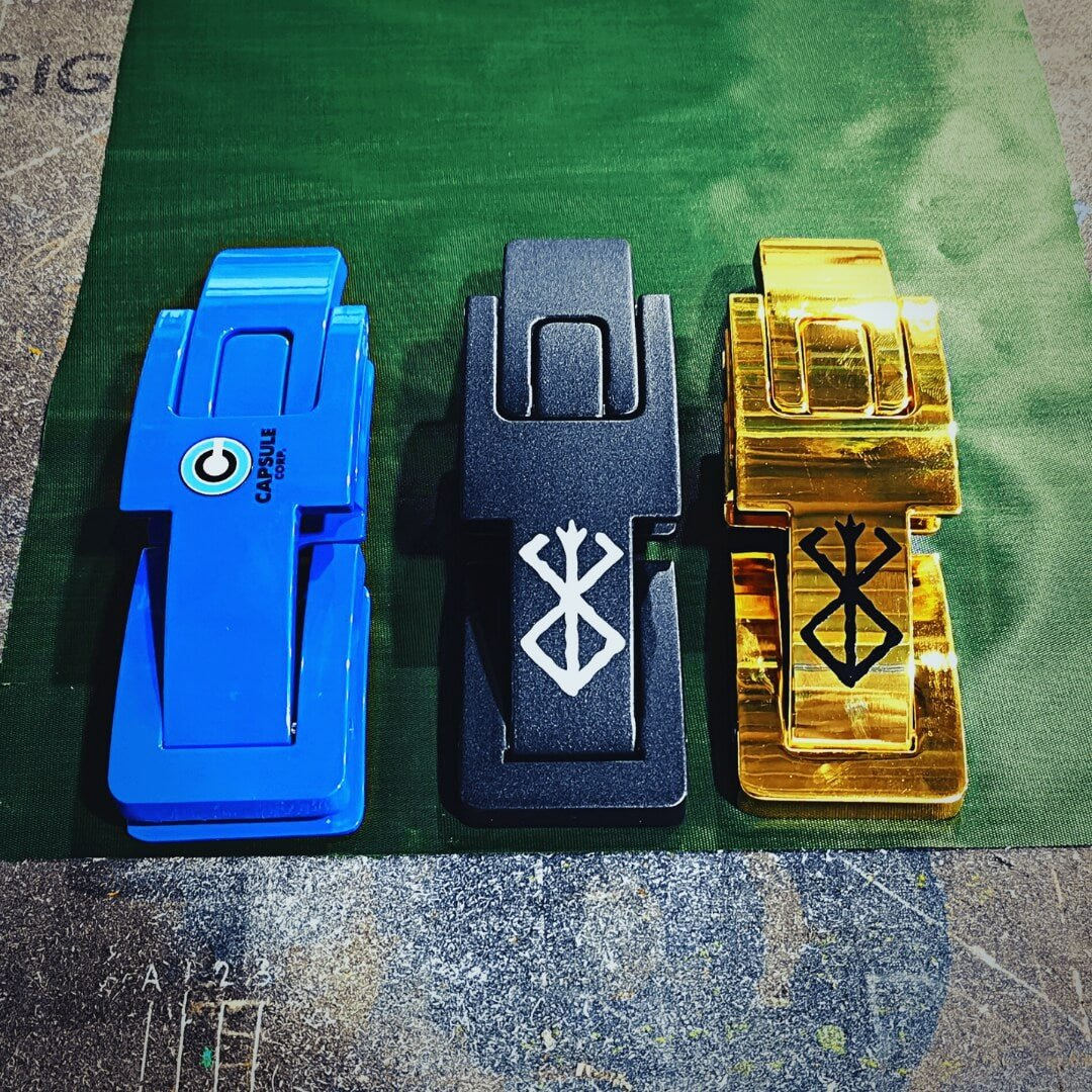 Adjustable lever belt buckles in blue, black and gold, custom printed with a round logo and two sigils.