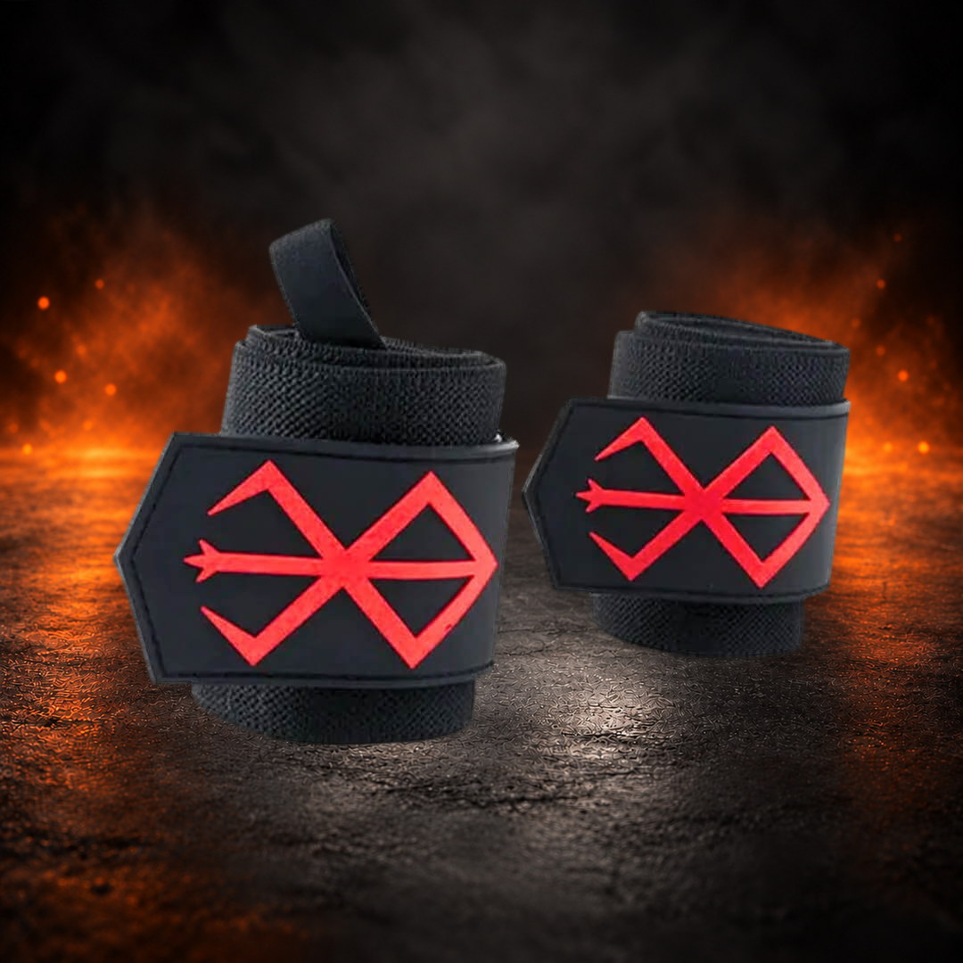 Powerlifting wrist wraps, rolled black pair standing upright, thumb loop up and red sigils facing out.