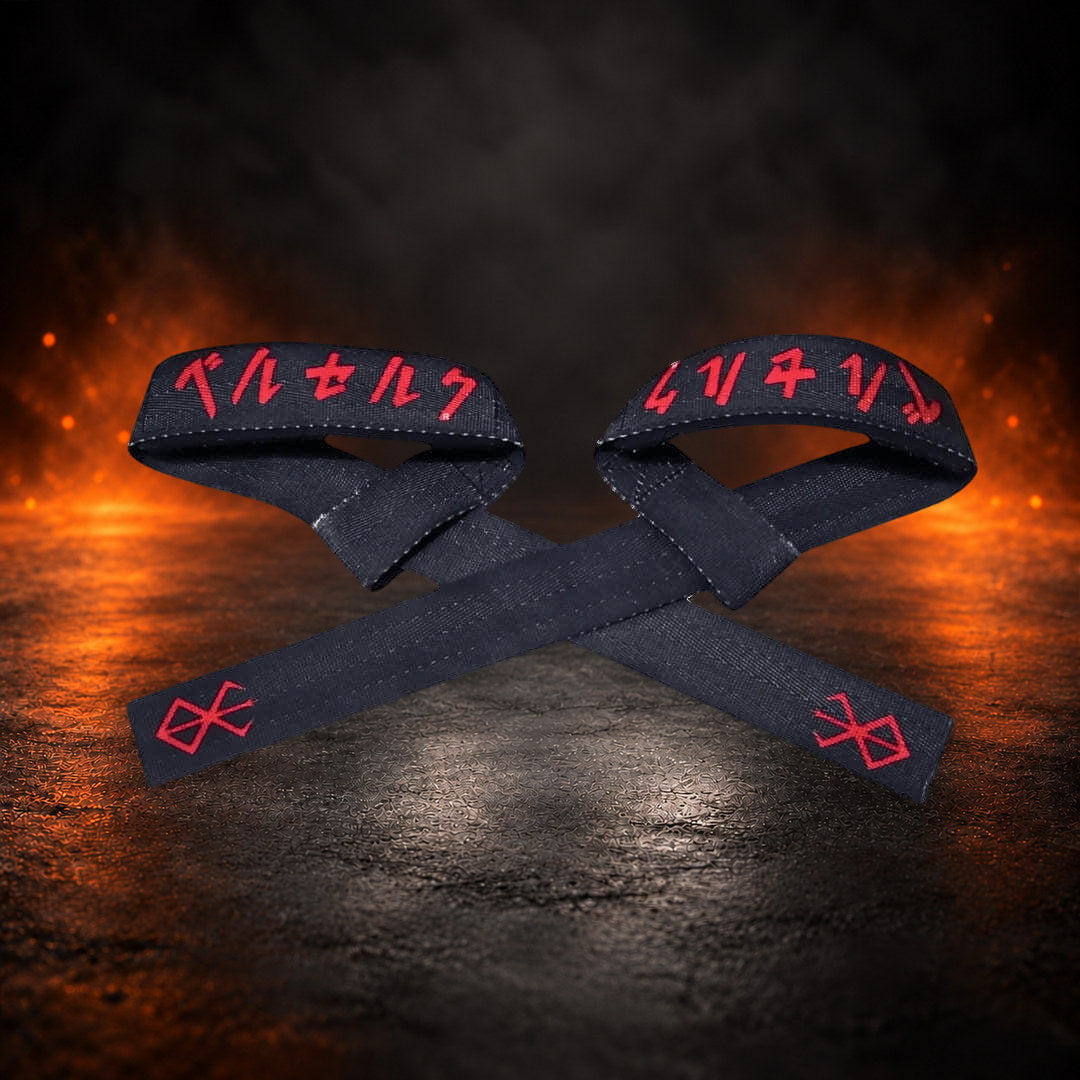 Lifting straps in black, crossed pair with closed loops showing red script and red marks.