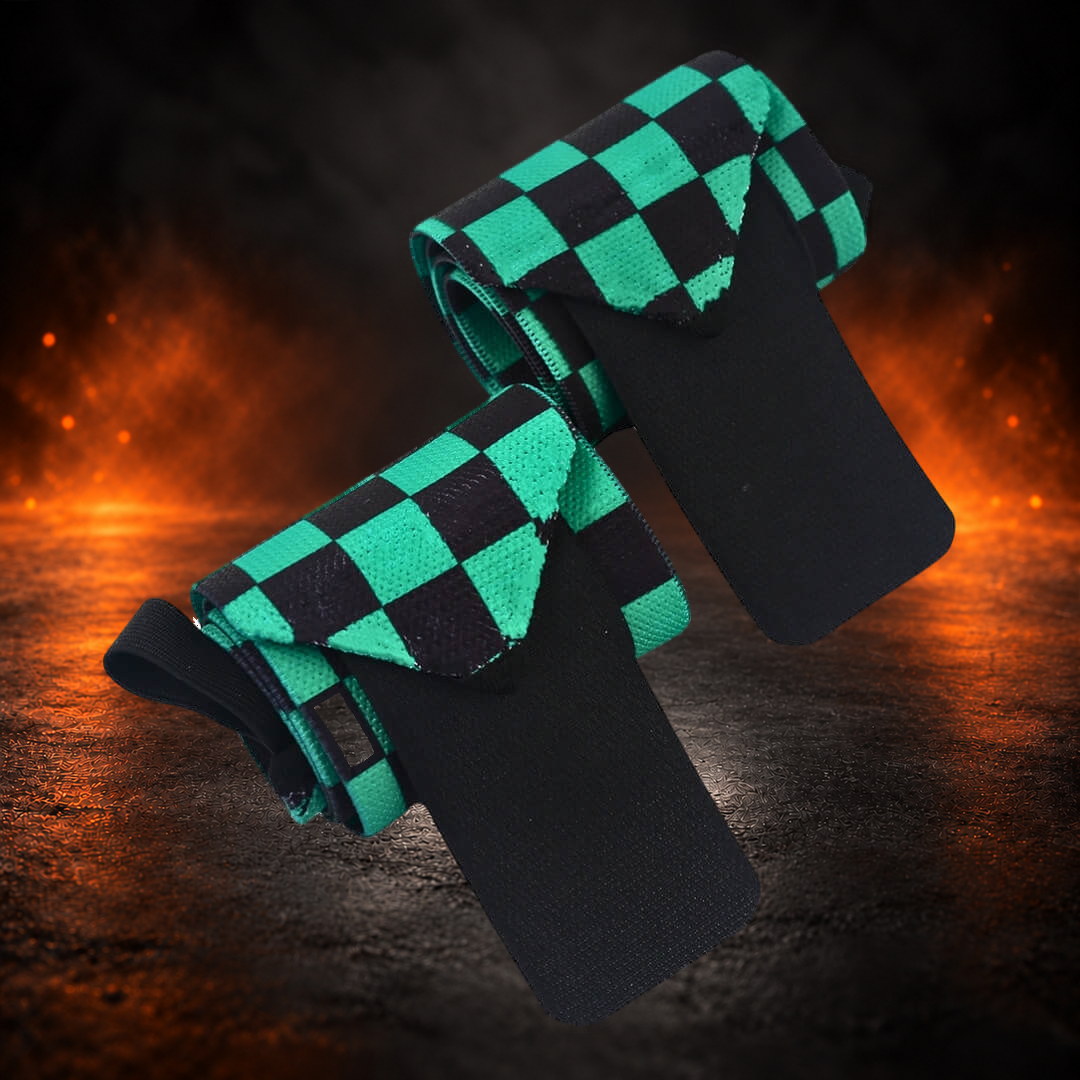 Powerlifting wrist wraps in green and black checkerboard, rolled pair with both black closure tabs open.