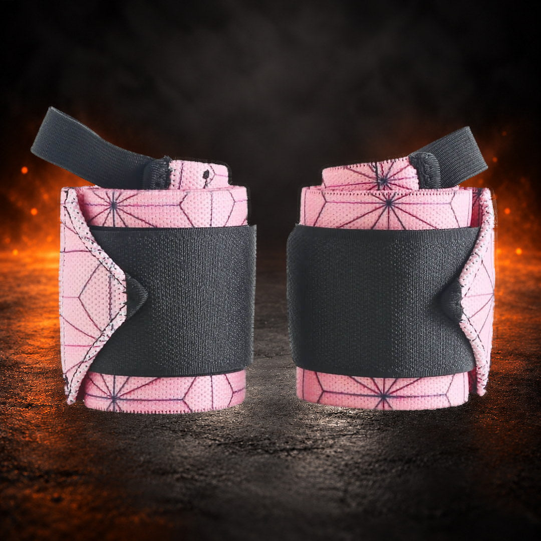 Powerlifting wrist wraps, rolled pink hemp-leaf pair under black closure bands and thumb loops, front view.