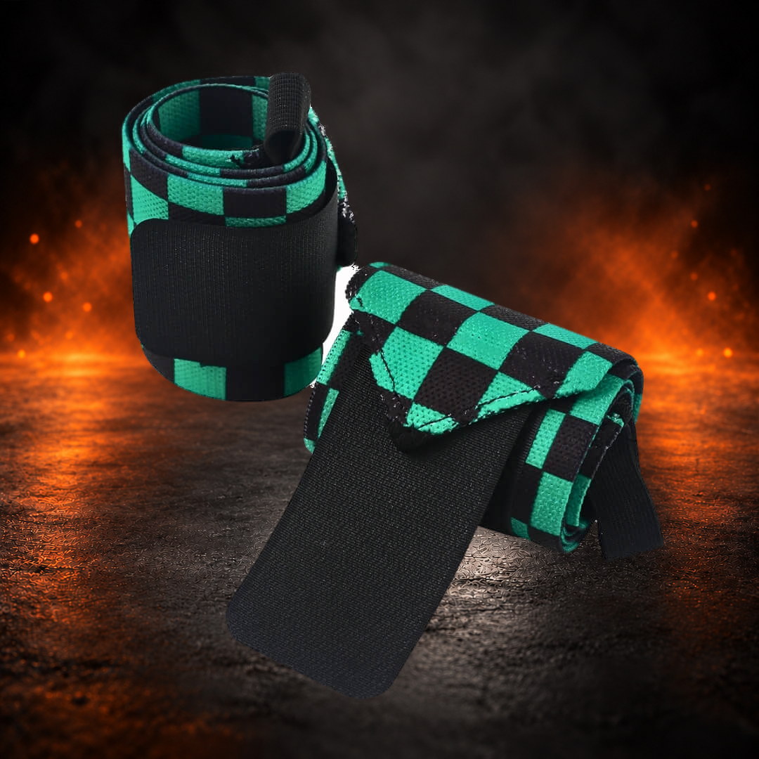 Powerlifting wrist wraps in green and black checkerboard, one rolled upright and one with its tab open.
