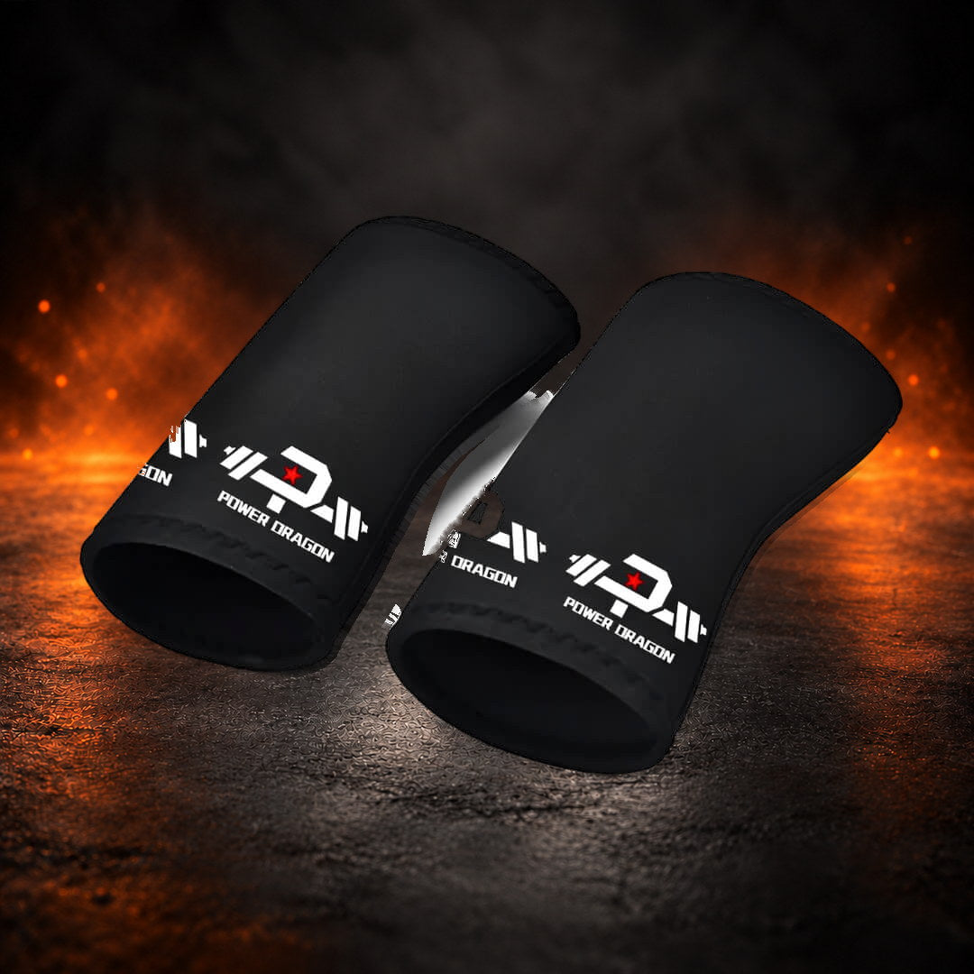 7mm stiff knee sleeves in black, pair lying side by side with open ends facing forward.