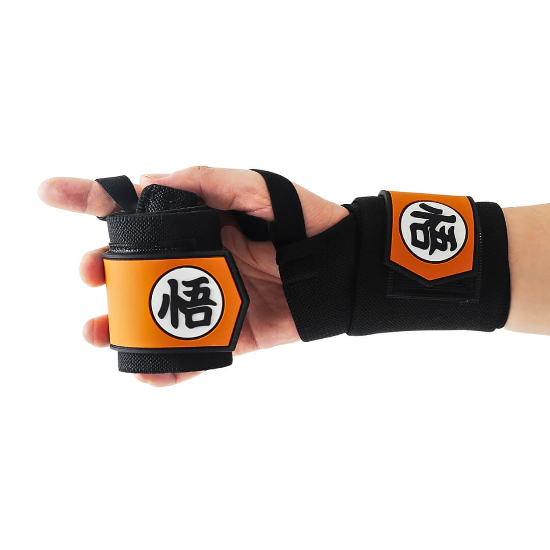Powerlifting wrist wraps in black and orange, one on the wrist and one rolled in hand.