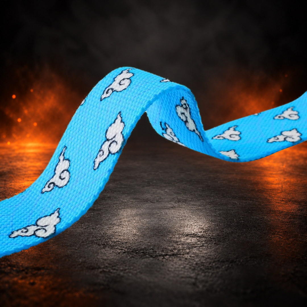 Lifting straps in sky blue, webbing close-up of white curly clouds with dark outlines.