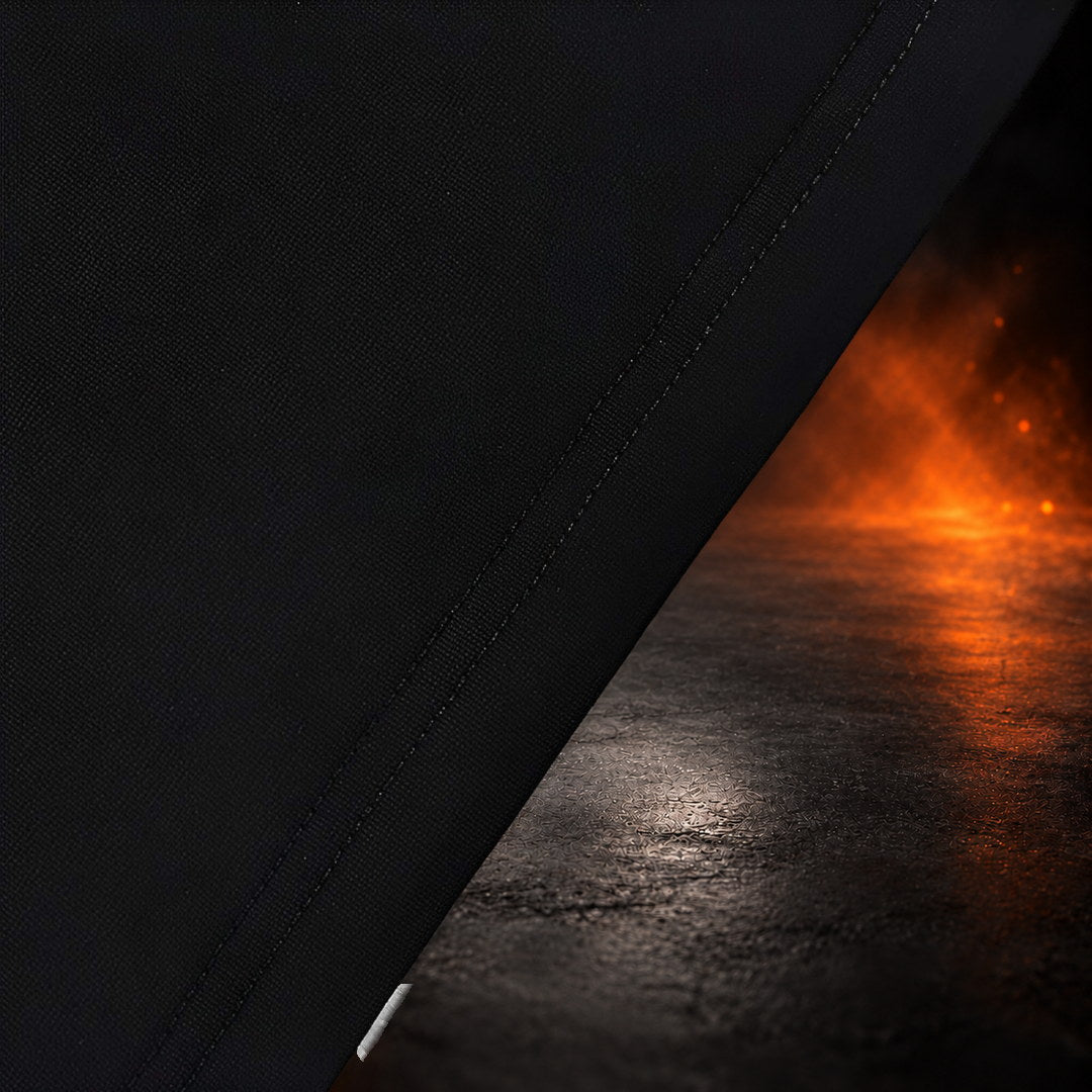 Bar grip shirt hem close-up, black fabric with a double row of stitching.
