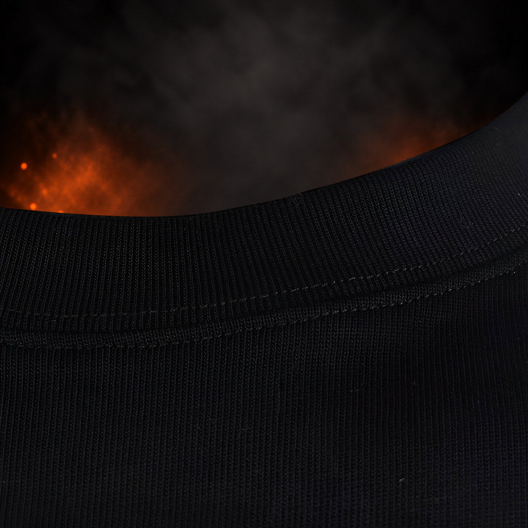 Bar grip shirt collar close-up, ribbed black crew neck with a stitched seam.