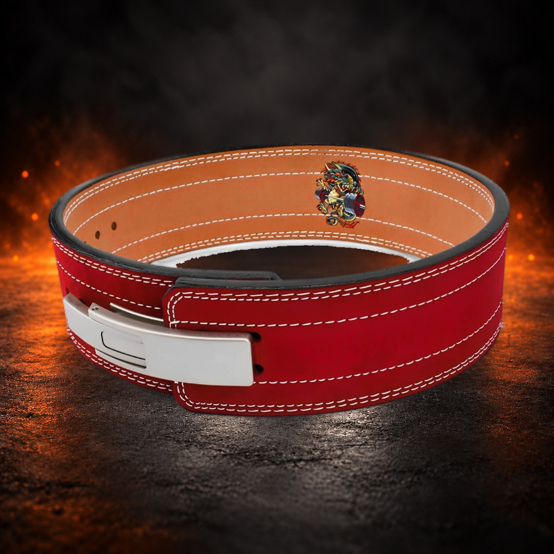 10mm lever belt in red suede, angled view with the silver lever, tan lining and dragon emblem.