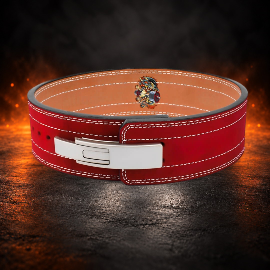 10mm lever belt in red suede, raised front view of the silver lever with the dragon emblem behind.