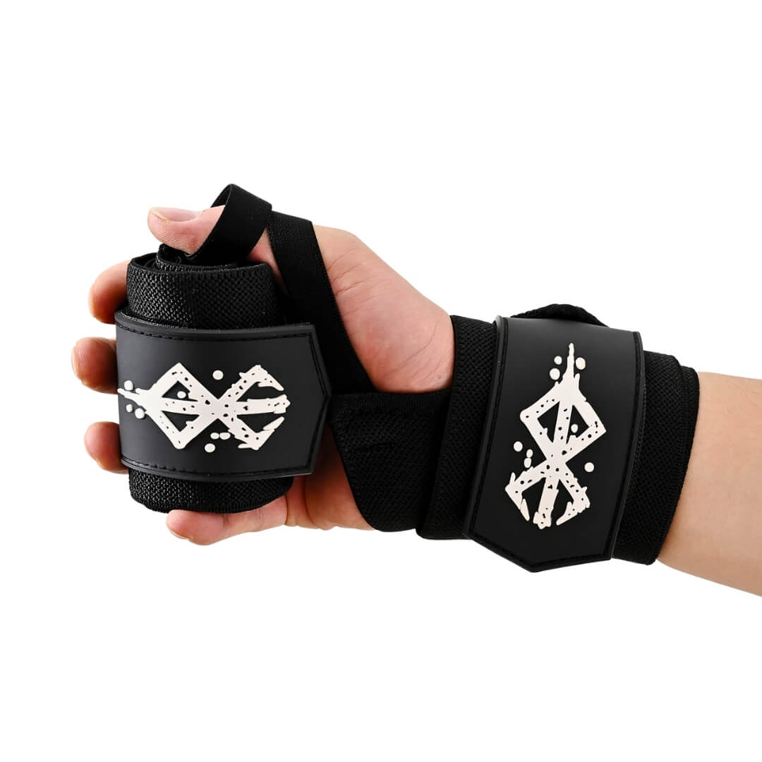 Powerlifting wrist wraps with white sigils, one worn on the wrist and one held in hand.