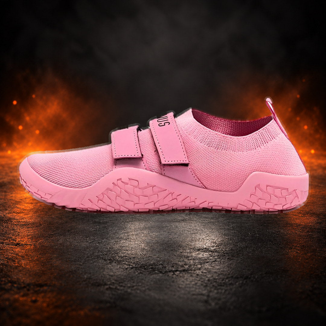 Deadlift slippers in pink with matching straps and sole, side view.