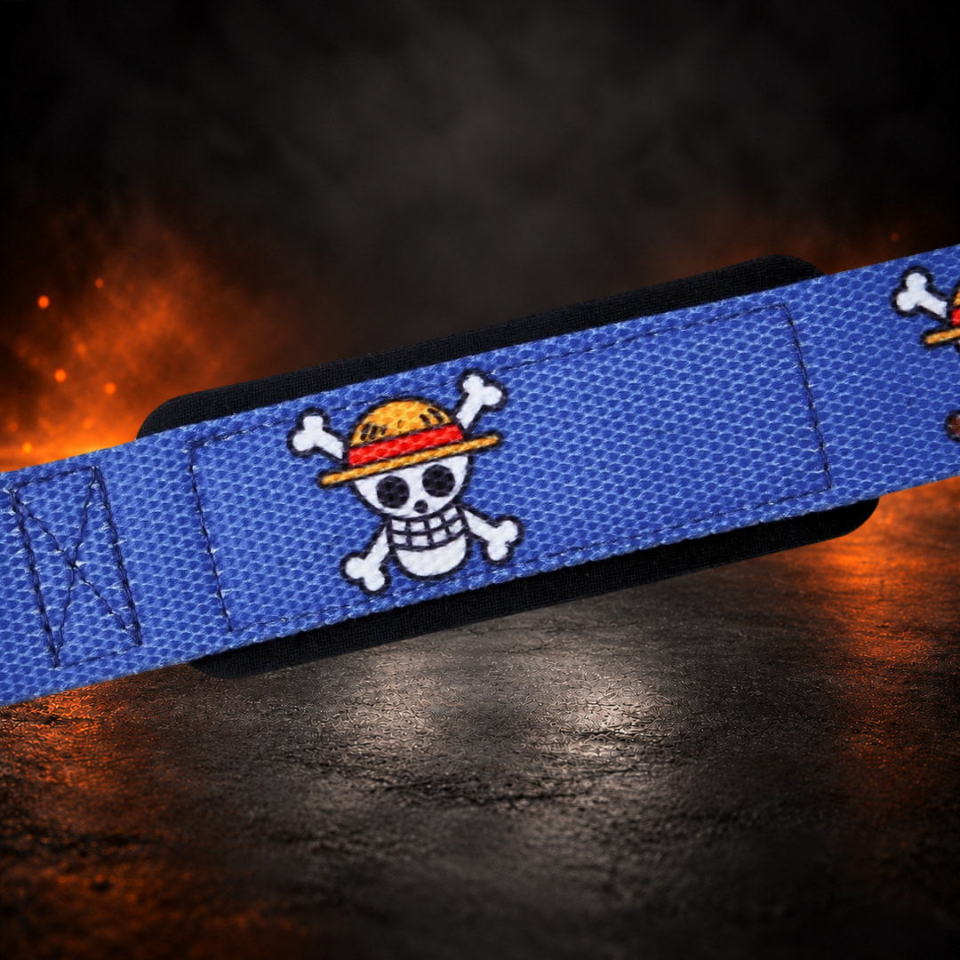 Lifting straps in royal blue, close-up of a skull in a red-banded hat over black padding.