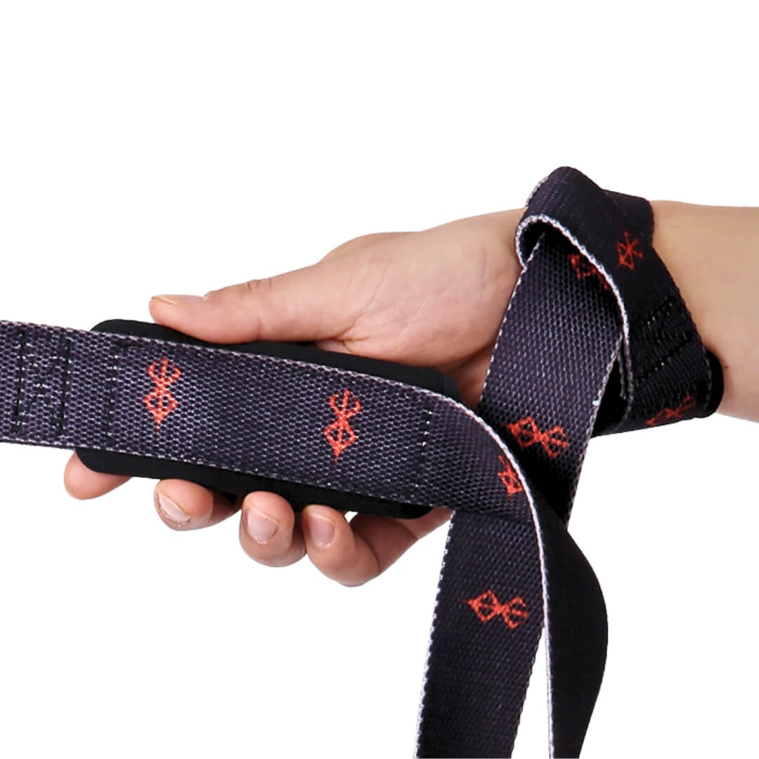 Lifting straps in black with red sigils, padded section held in the hand.