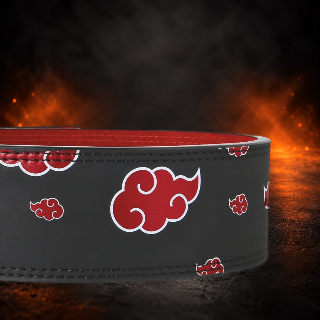 Powerlifting lever belt in black, close-up of large and small red clouds outlined in white.