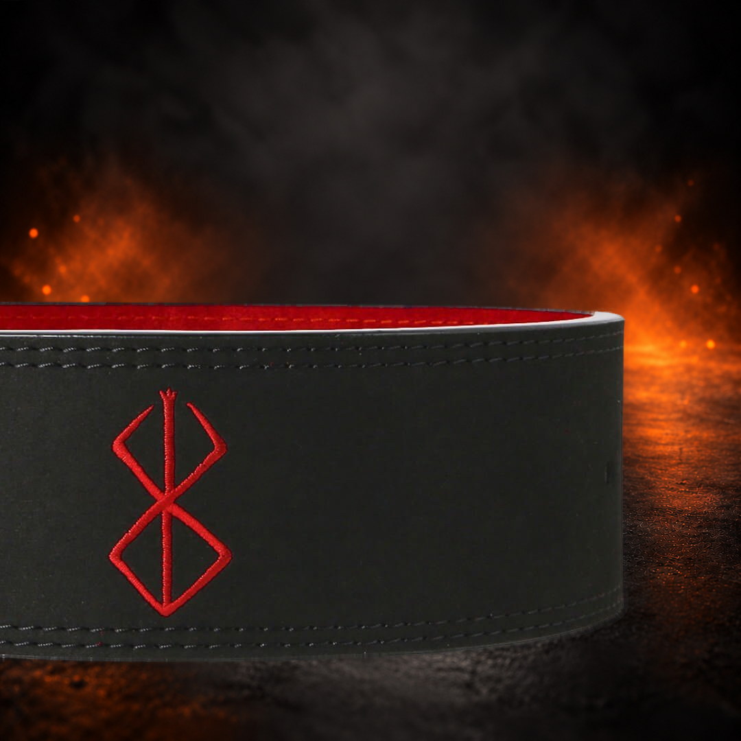 Powerlifting lever belt close-up of the red thread sigil stitched into black leather.