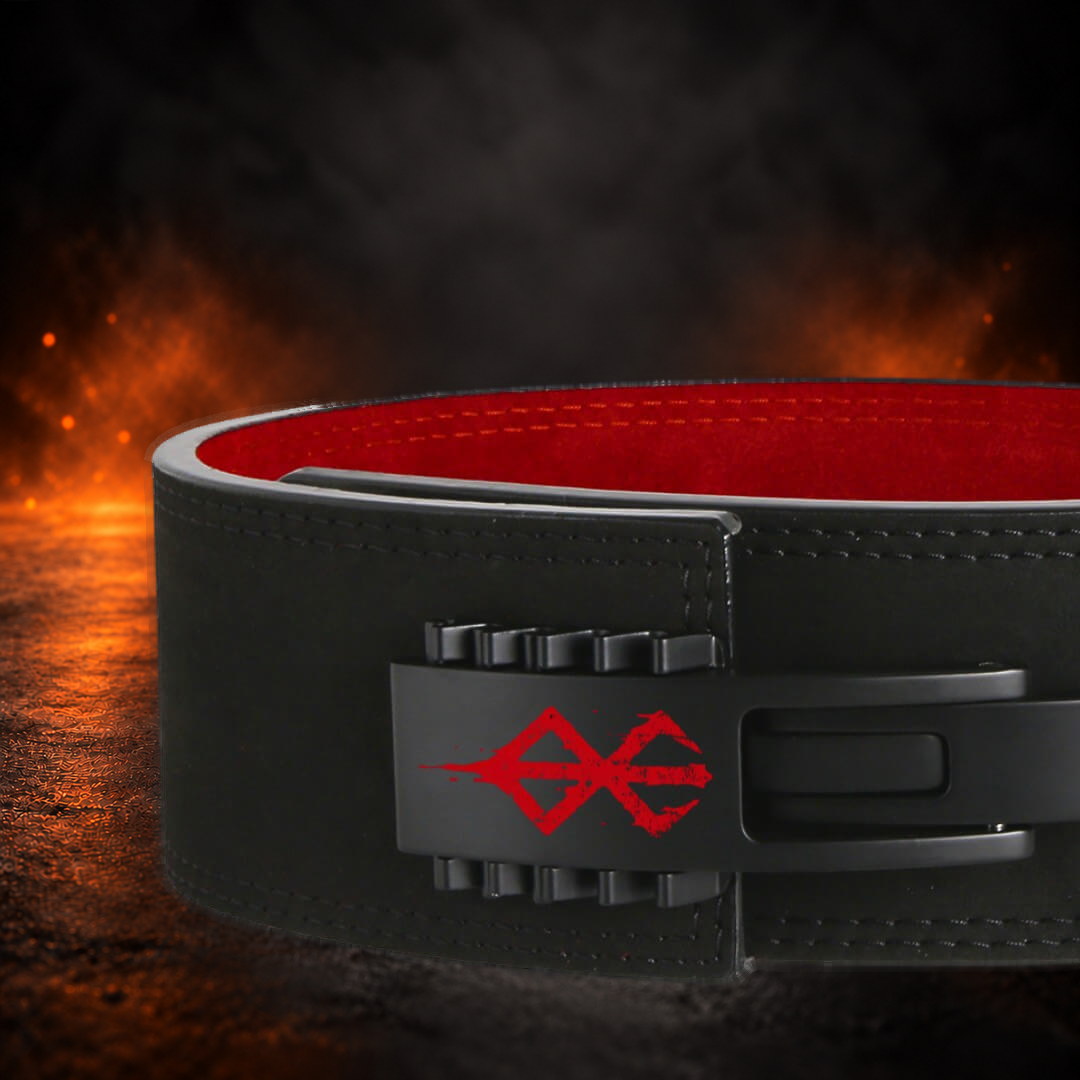 Adjustable lever belt buckle with a red sigil on black, close-up with red suede lining.