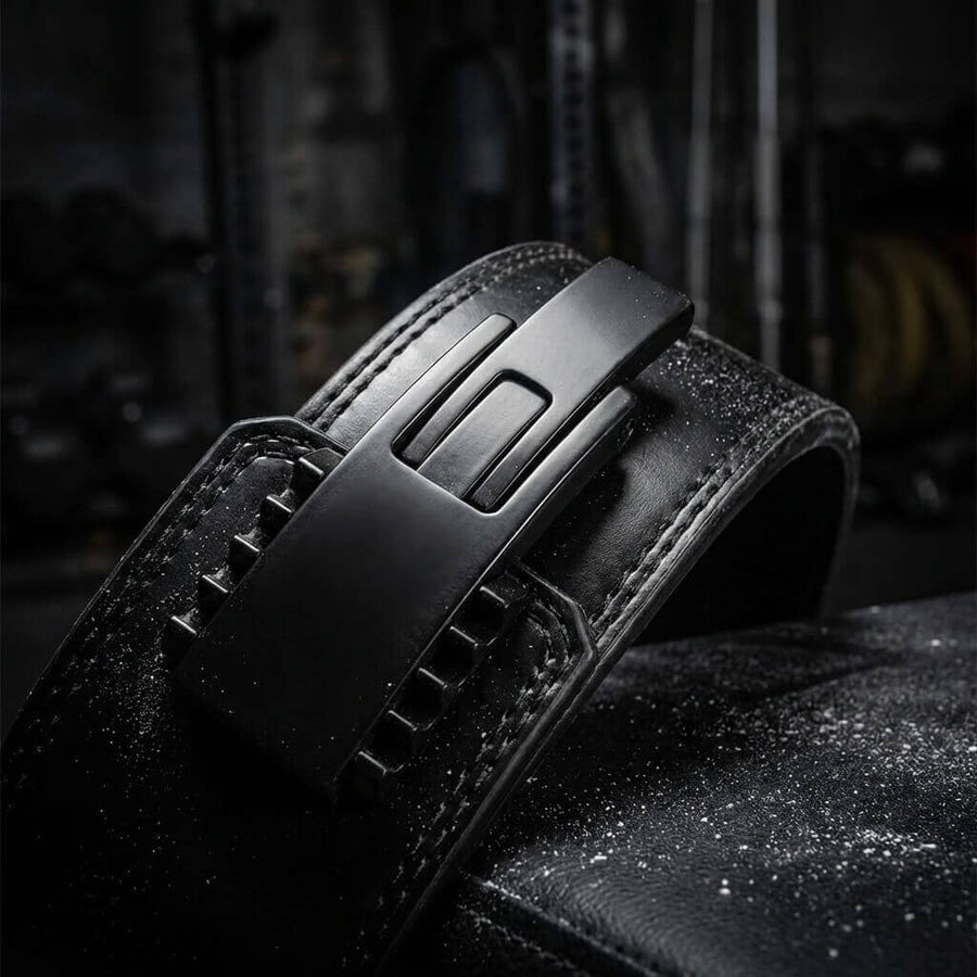 Black leather powerlifting lever belt with matte black buckle.